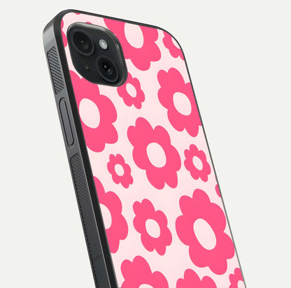 Blush Flower Pop iPhone 15 Plus glass phone case angled back view highlighting bright floral pop design and side grip texture