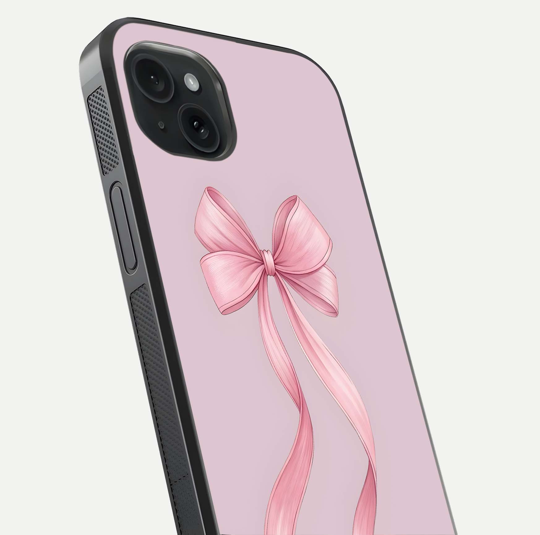 Soft Blush Bow iPhone 15 Plus glass phone case angled back view highlighting bow artwork and side grip texture