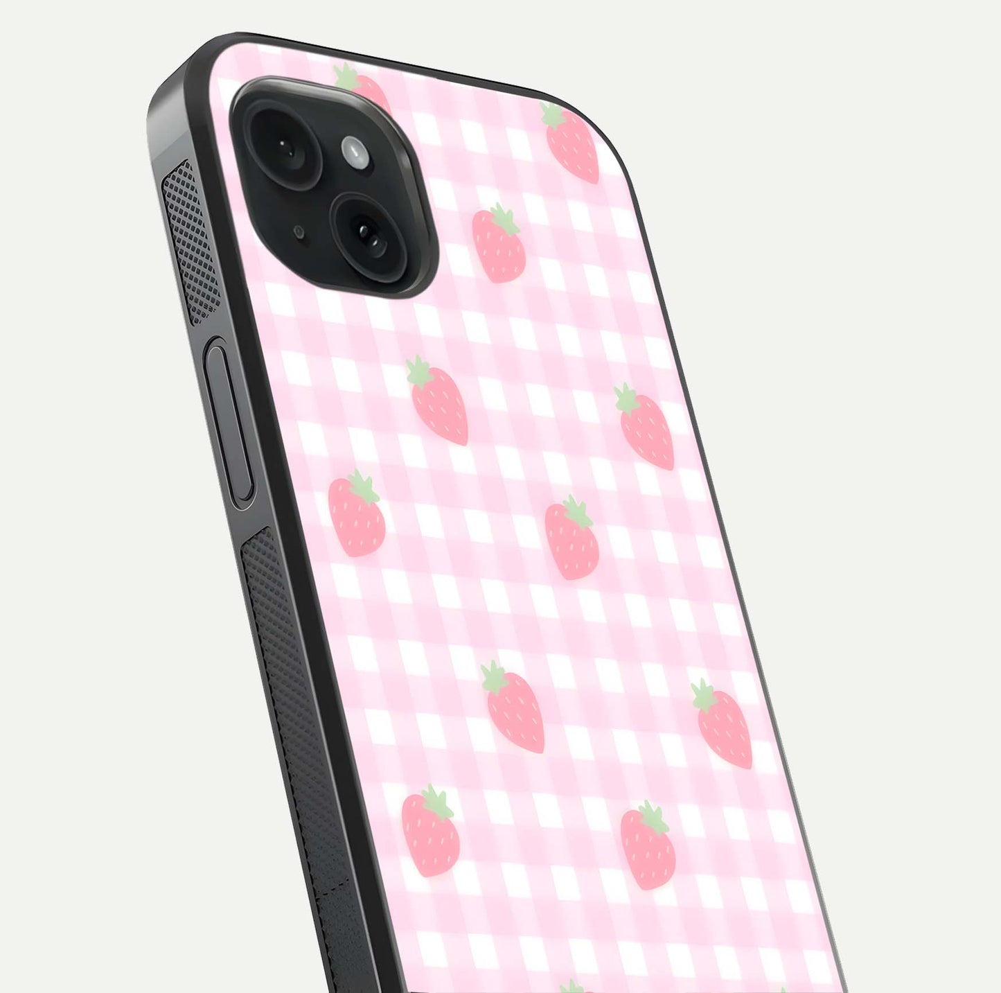 Strawberry Picnic Love iPhone 15 Plus glass phone case angled back view highlighting strawberry illustrations and textured grip