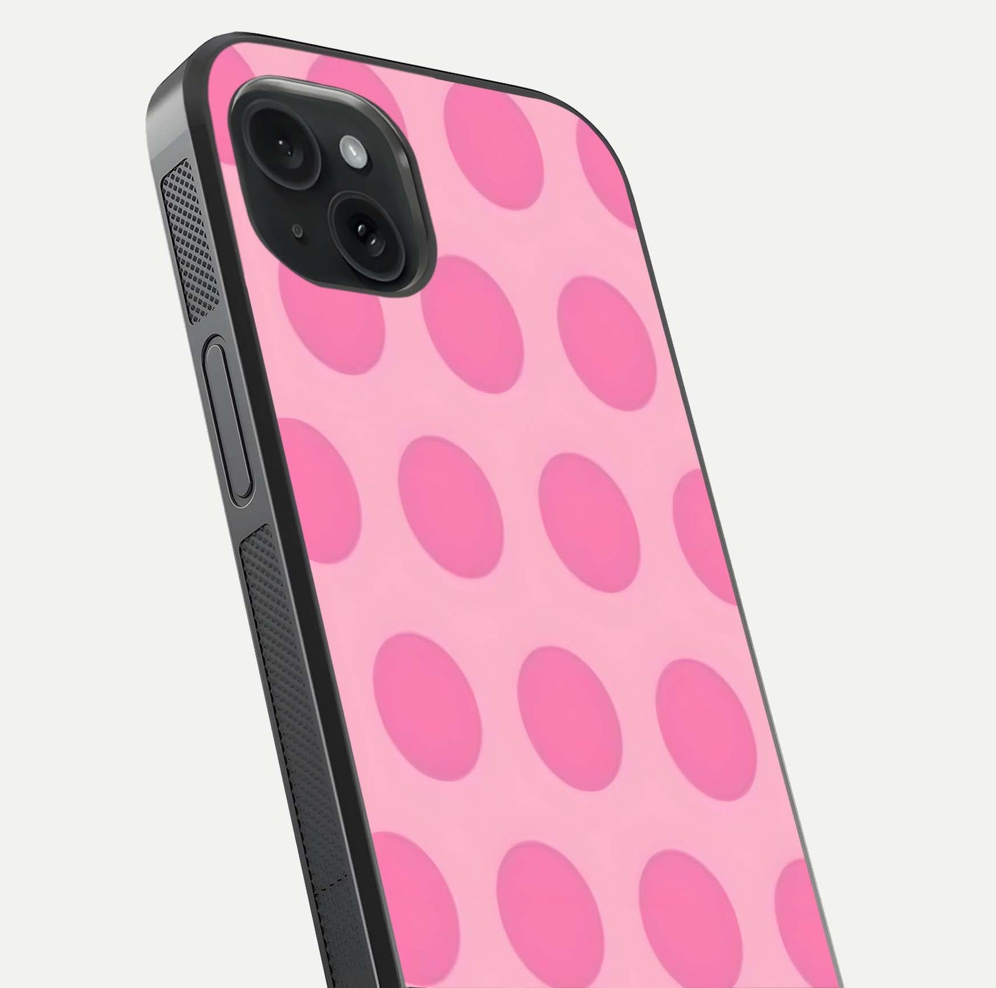 Sweet Dot Dreams iPhone 15 Plus glass phone case angled back view highlighting dotted artwork and side grip texture