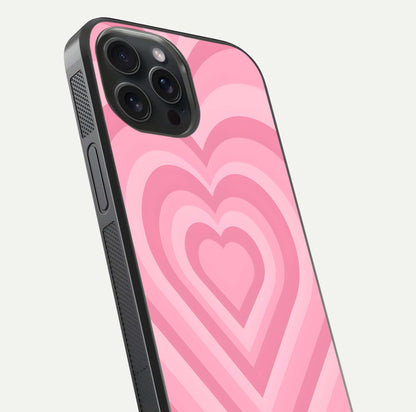 Blush Heart Waves iPhone 15 Pro glass phone case angled back view highlighting romantic heart wave artwork and grip texture