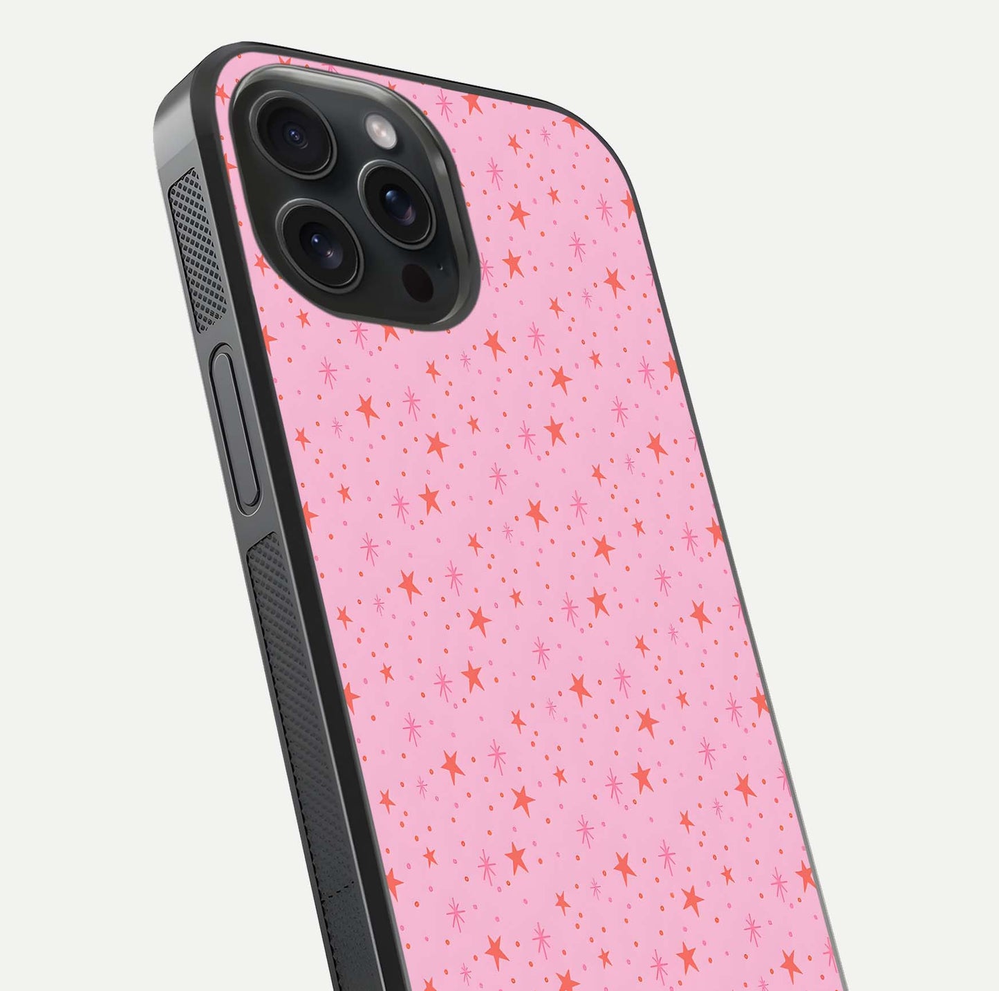 Cosmic Pink Sparkle iPhone 15 Pro glass phone case angled back view highlighting sparkling galaxy design and textured side grip