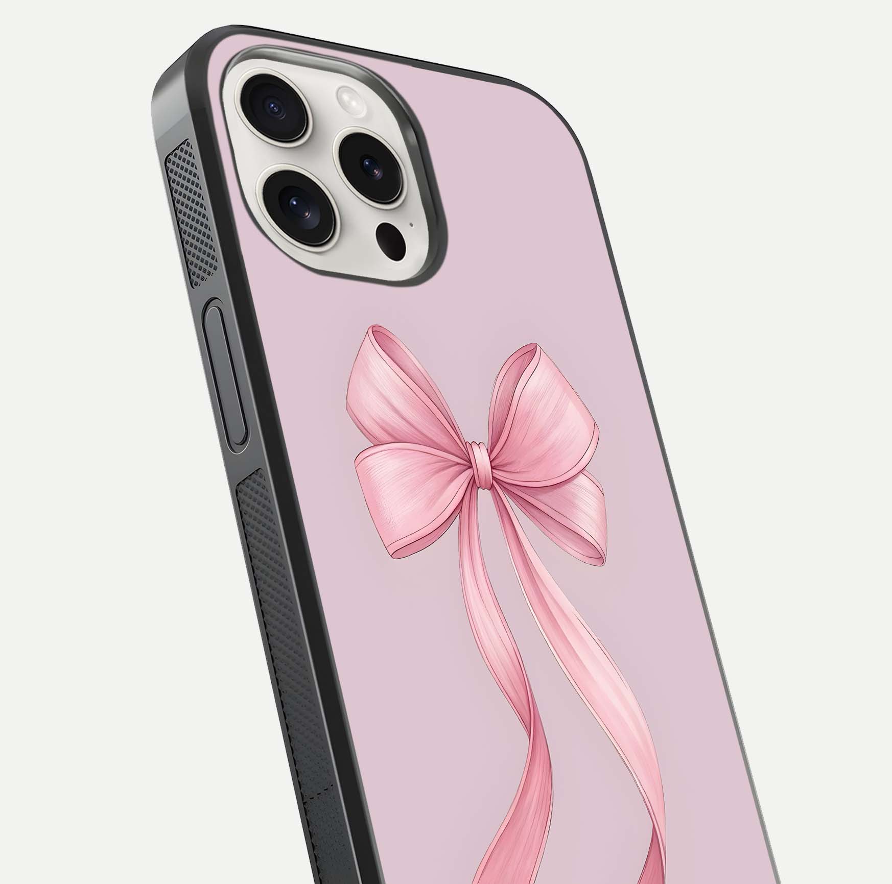 Soft Blush Bow iPhone 15 Pro Max glass phone case angled back view highlighting bow artwork and side grip texture
