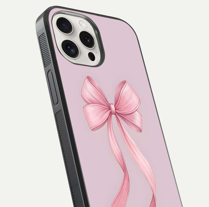Soft Blush Bow iPhone 15 Pro Max glass phone case angled back view highlighting bow artwork and side grip texture