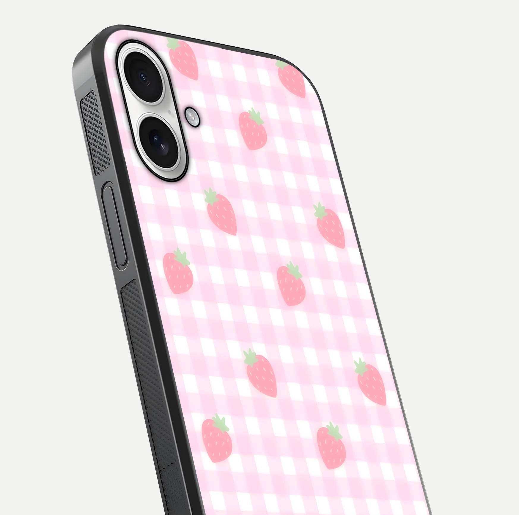 Strawberry Picnic Love iPhone 17 glass phone case angled back view highlighting strawberry illustrations and textured grip