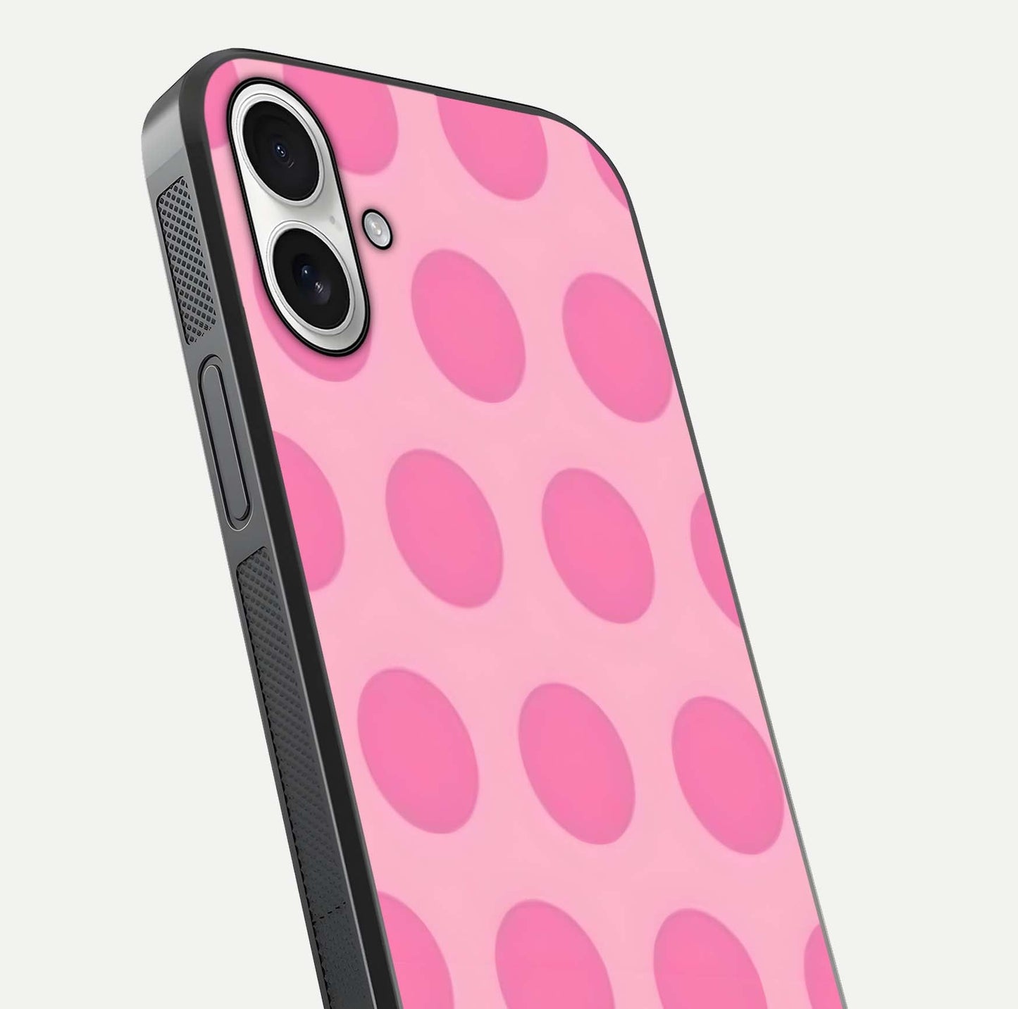 Sweet Dot Dreams iPhone 17 glass phone case angled back view highlighting dotted artwork and side grip texture