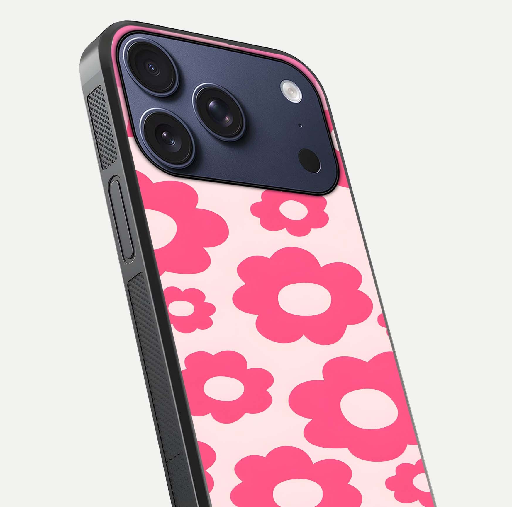 Blush Flower Pop iPhone 17 Pro glass phone case angled back view highlighting bright floral pop design and side grip texture