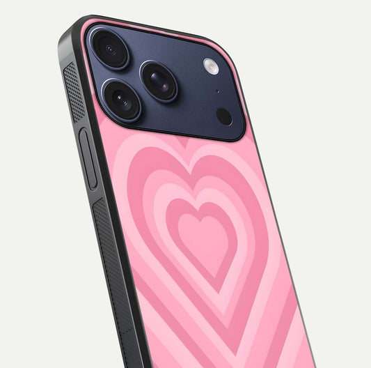 Blush Heart Waves iPhone 17 Pro glass phone case angled back view highlighting romantic heart wave artwork and grip texture