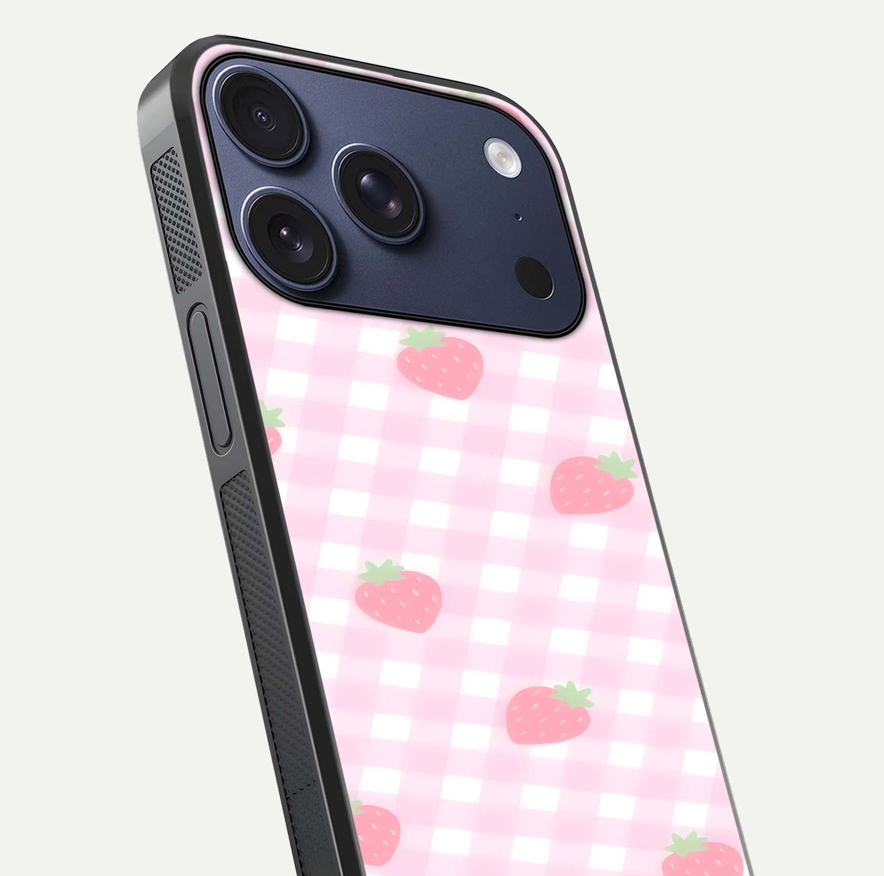 Strawberry Picnic Love iPhone 17 Pro glass phone case angled back view highlighting strawberry illustrations and textured grip