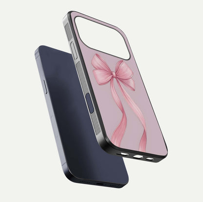 Soft Blush Bow iPhone 17 Pro glass phone case floating view emphasizing glossy surface and soft feminine styling
