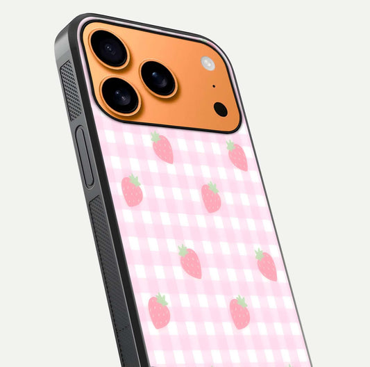 Strawberry Picnic Love iPhone 17 Pro Max glass phone case angled back view highlighting strawberry illustrations and textured grip