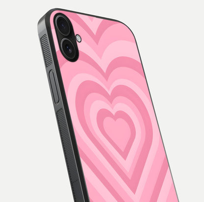 Blush Heart Waves iPhone 16 Plus glass phone case angled back view highlighting romantic heart wave artwork and grip texture