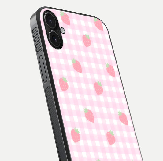 Strawberry Picnic Love iPhone 16 Plus glass phone case angled back view highlighting strawberry illustrations and textured grip
