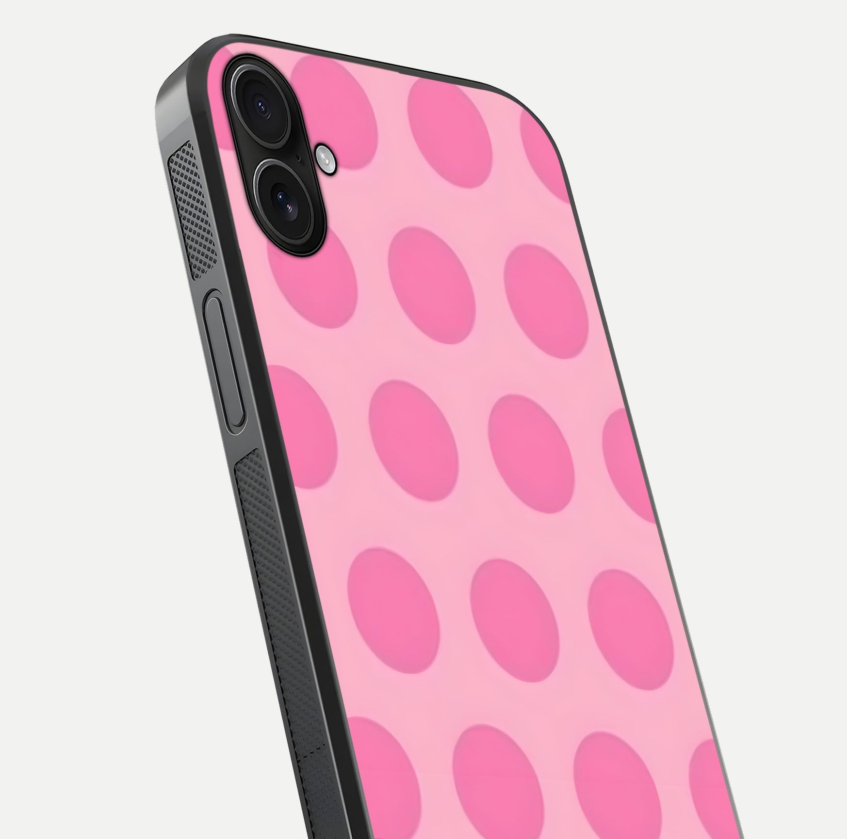 Sweet Dot Dreams iPhone 16 Plus glass phone case angled back view highlighting dotted artwork and side grip texture