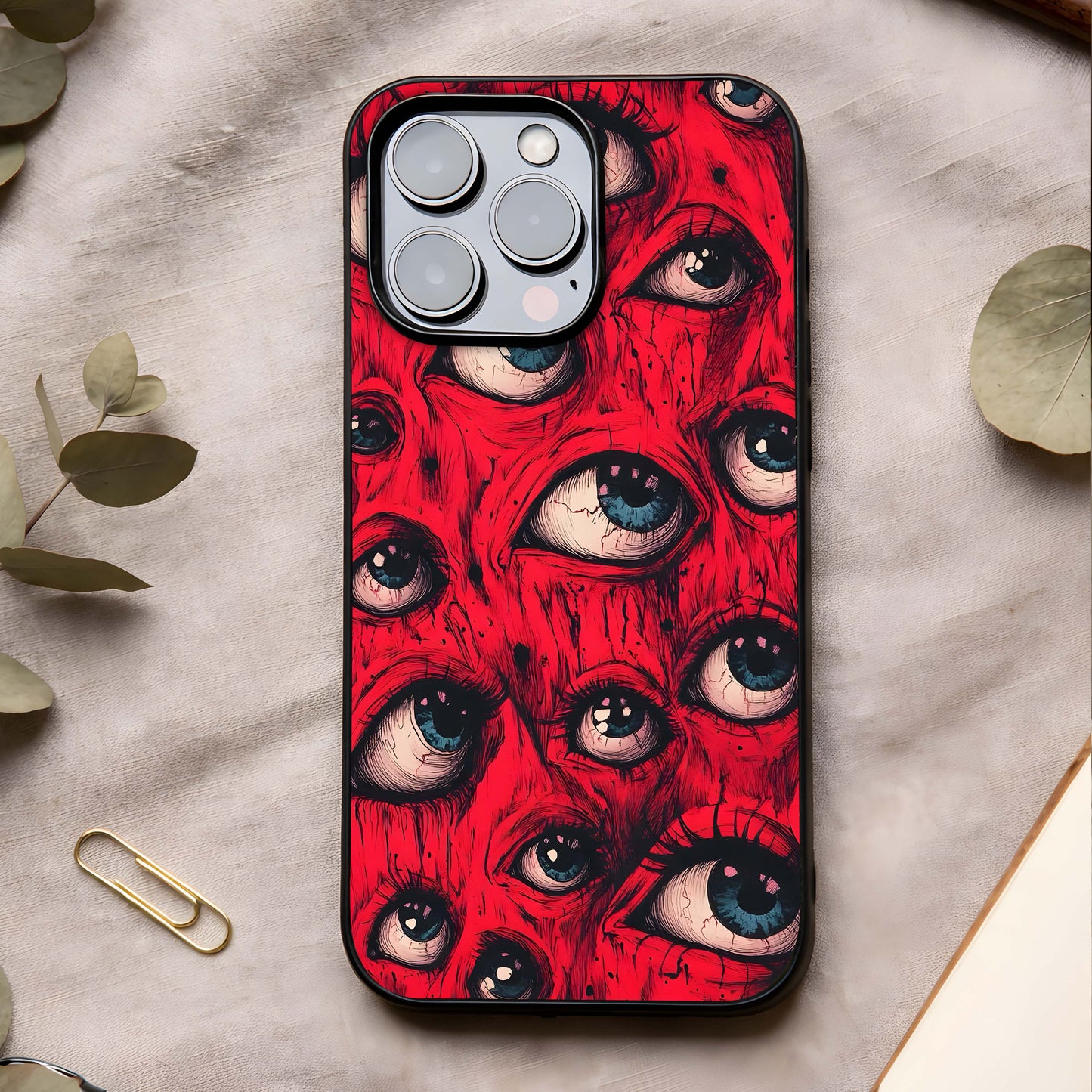 Crimson Watch Eyes Glass Case showing full back design in clean flat view with striking eye artwork and glossy glass finish.
