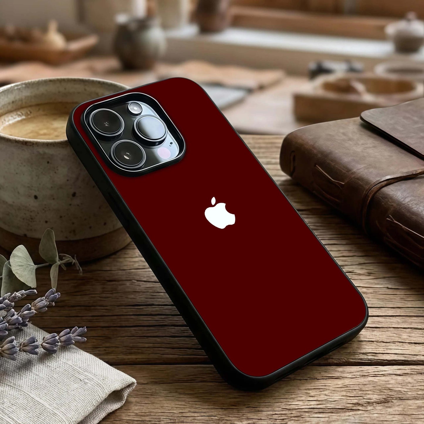 Apple Crimson Core Glass Case captured at a warm angle highlighting bold color depth, gloss, and edge clarity.