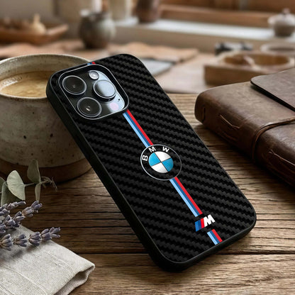 BMW Pattern Glass Case captured at a warm angle highlighting structured motifs, gloss, and edge clarity.