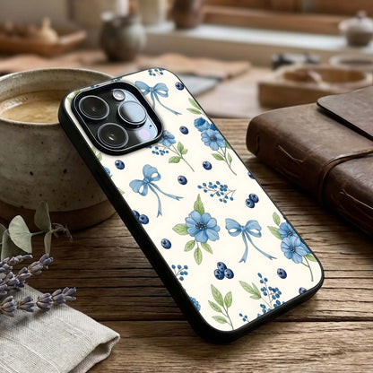 Blue Flower & Bow Glass Case captured at a warm angle highlighting soft details, gloss, and edge clarity.