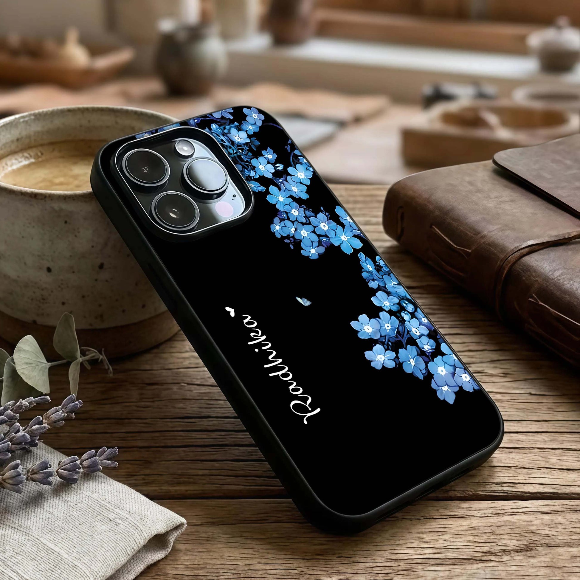 Blue Petal Dream Custom Name Glass Case captured at a warm angle highlighting petal textures, gloss, and edge clarity.