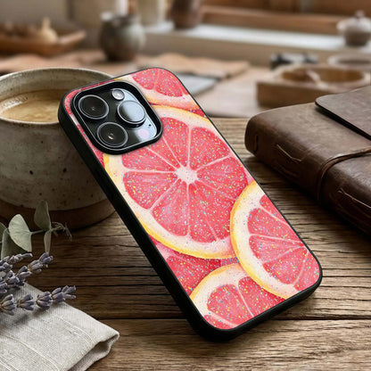 Glitter Grapefruit Glass Case captured at a warm angle highlighting shimmer details, gloss, and edge clarity.