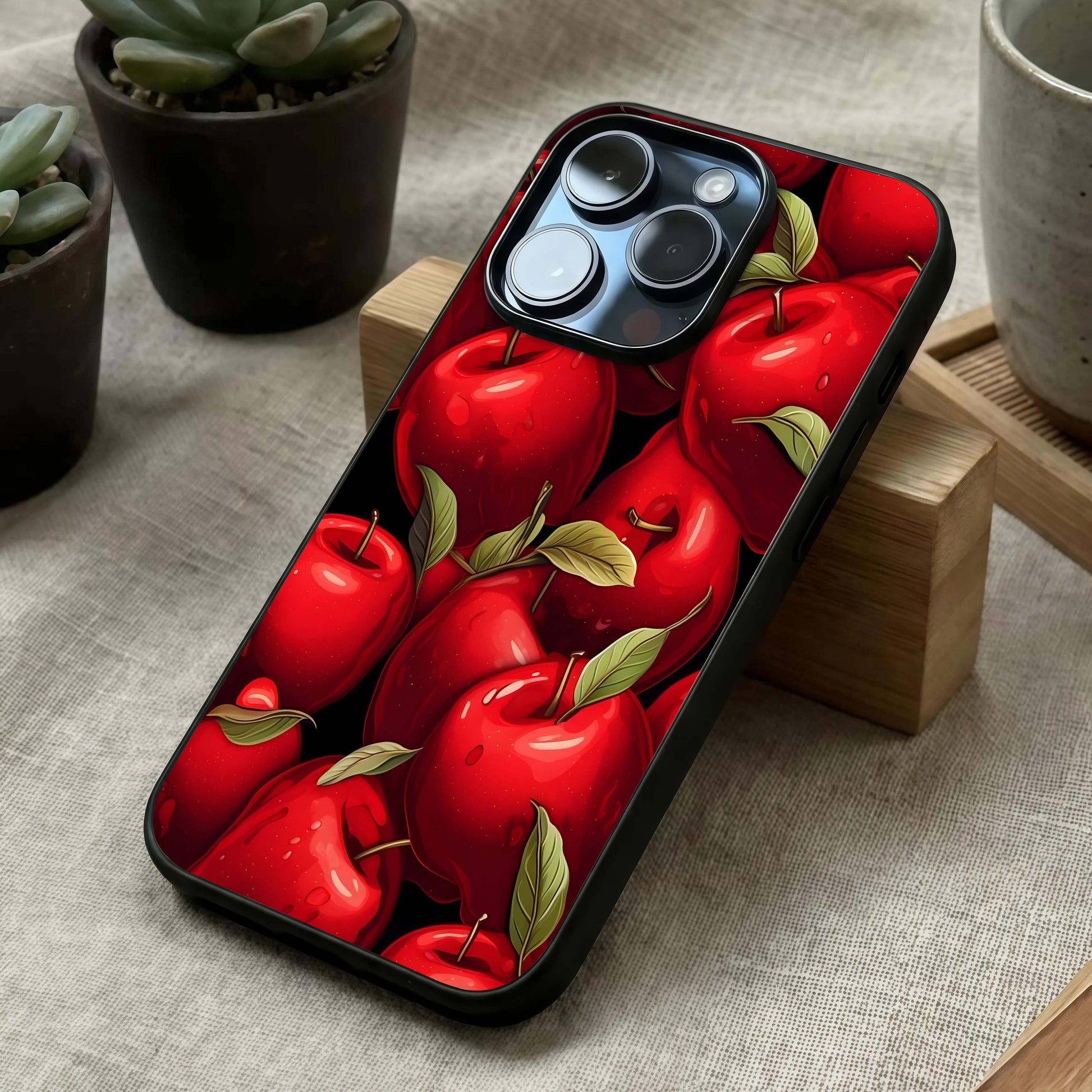 Apple Pattern Glass Case laid diagonally highlighting side pattern flow and HD glass shine.
