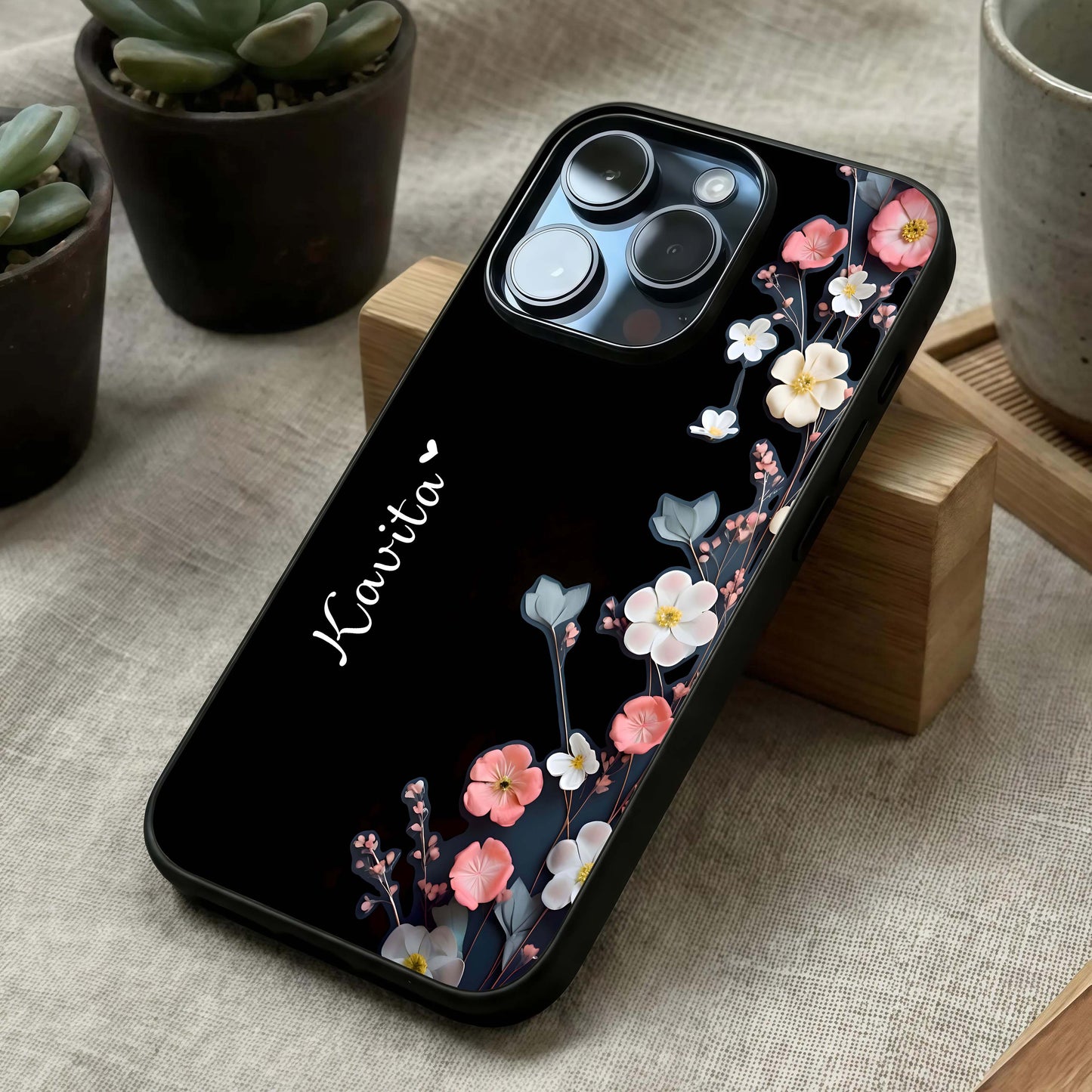 Black Elegance Floral Custom Name Glass Case laid diagonally highlighting floral contrast and HD glass shine.