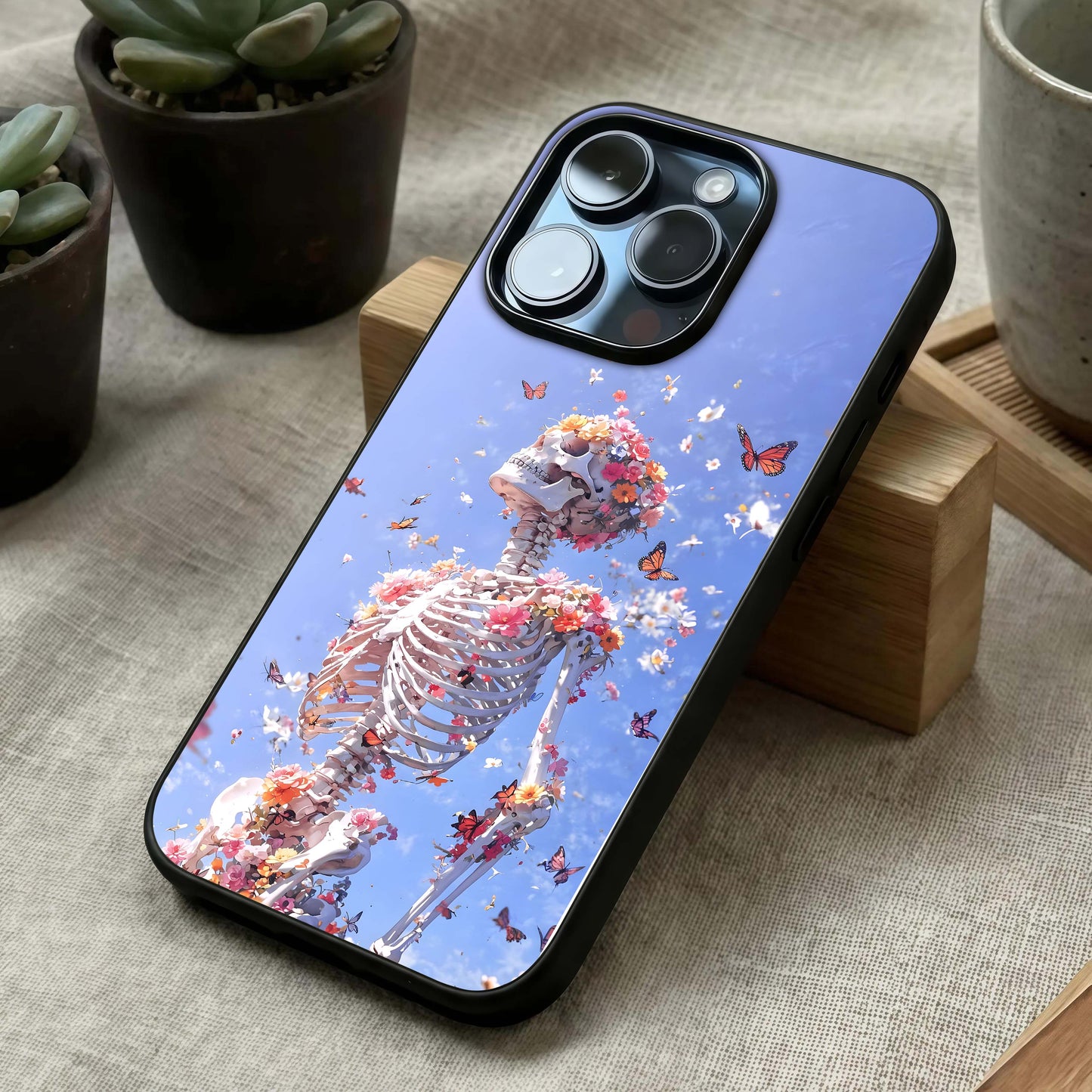 Bloom Beyond Bones Glass Case laid diagonally highlighting layered elements and HD glass shine.