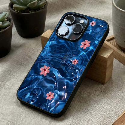 Blooming Water Drift Glass Case laid diagonally highlighting wave-like motion and HD glass shine.