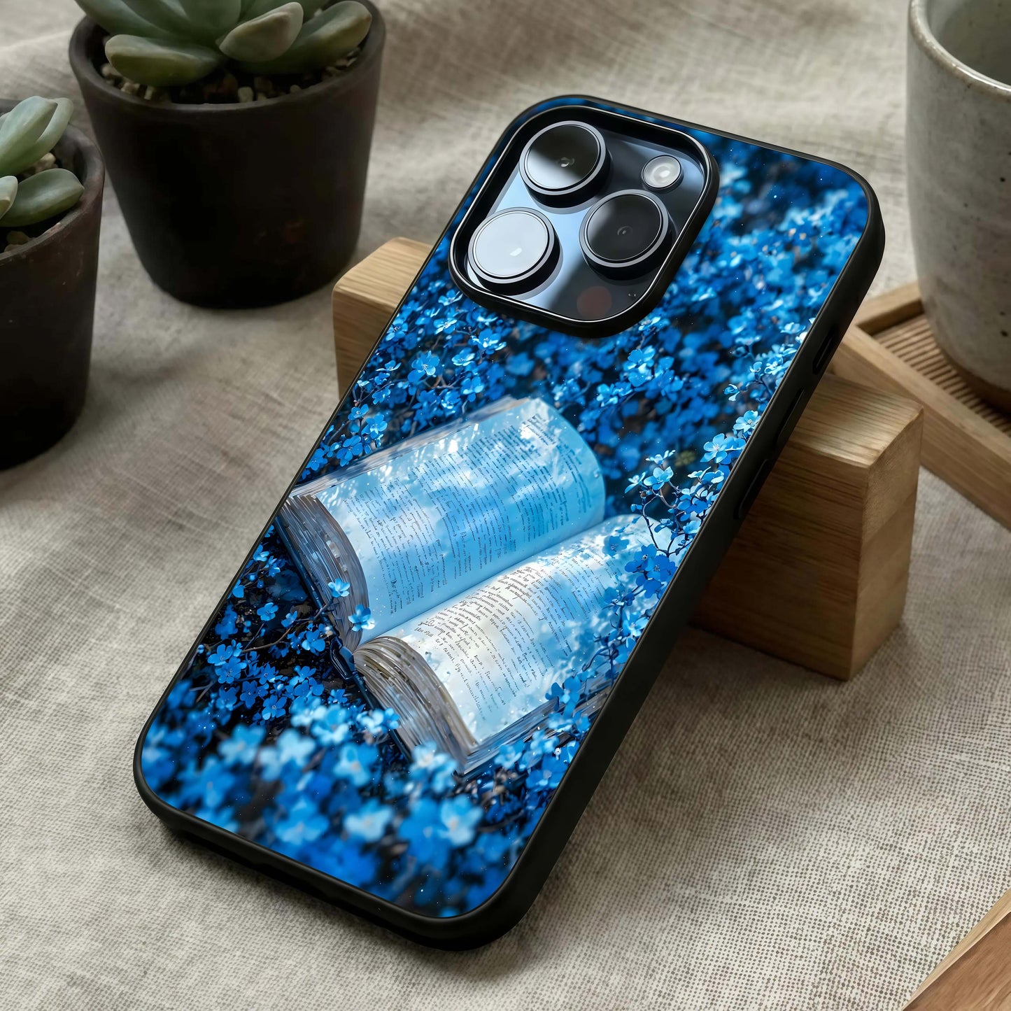Blue Bloom Tales Glass Case laid diagonally highlighting delicate patterns and HD glass shine.