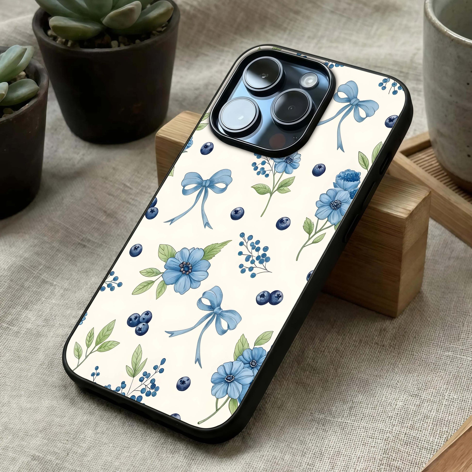 Blue Flower & Bow Glass Case laid diagonally highlighting decorative elements and HD glass shine.