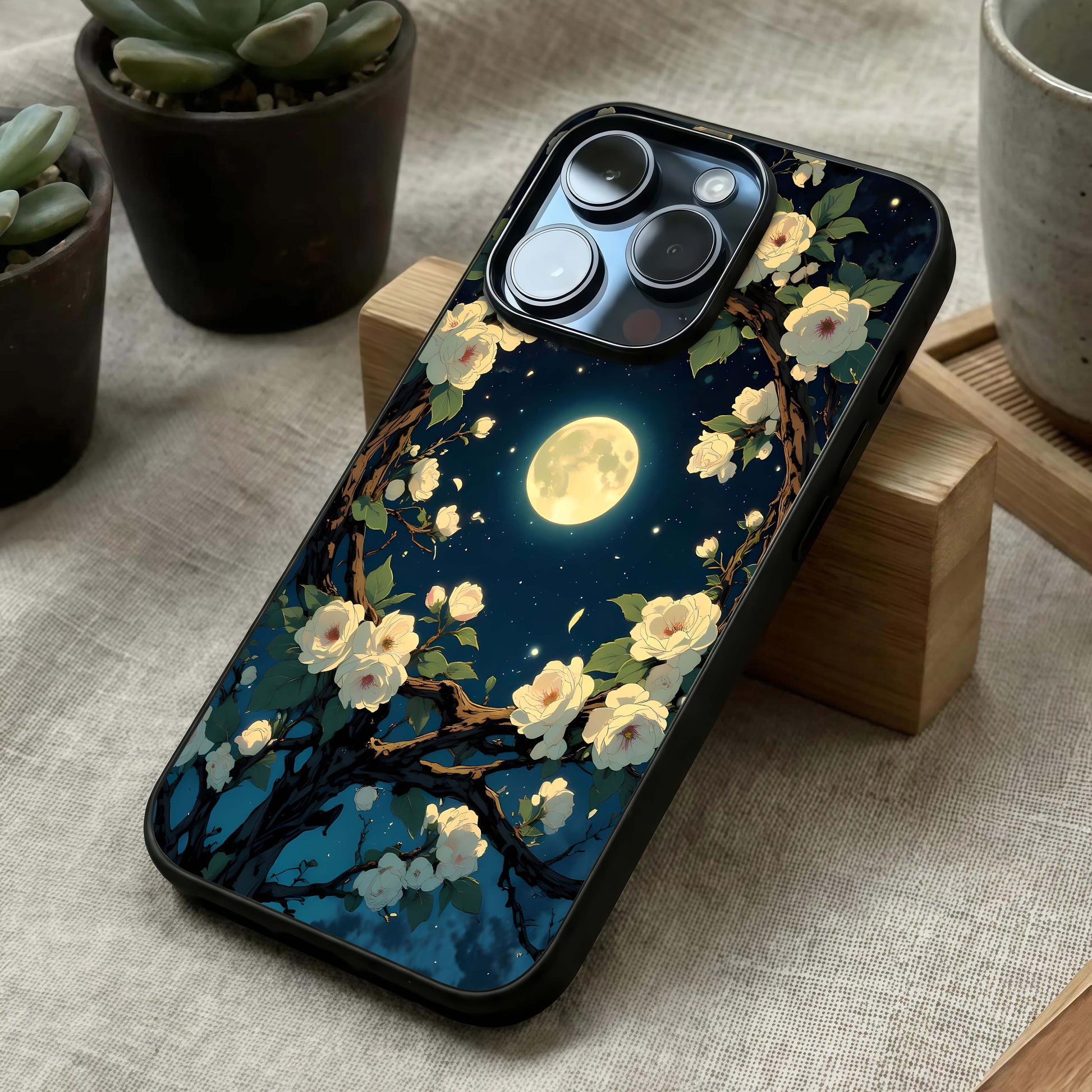 Celestial Moon & Flower Glass Case laid diagonally highlighting moonlit details and HD glass shine.