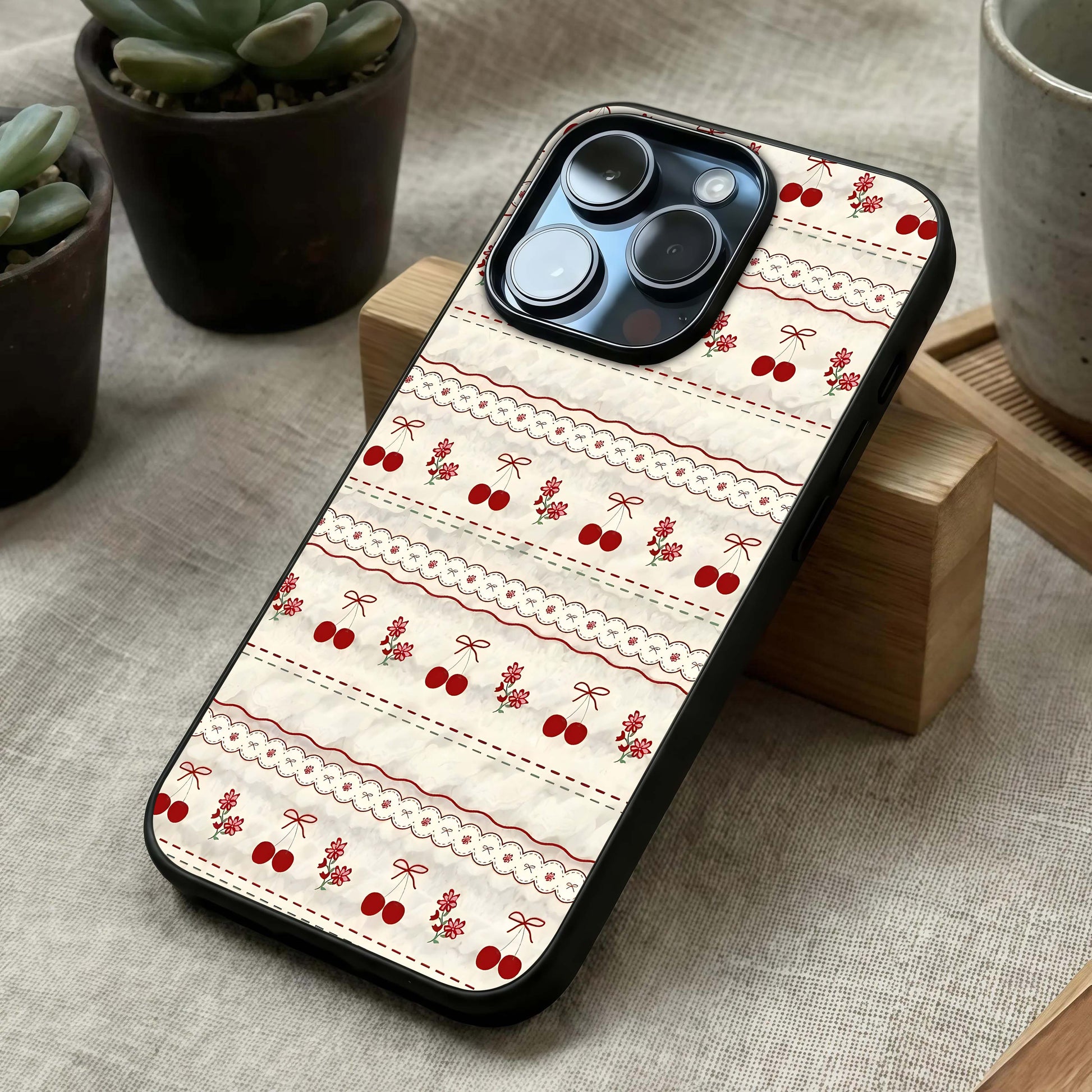 Cherry Bloom Charm Glass Case laid diagonally highlighting petal flow and HD glass shine.