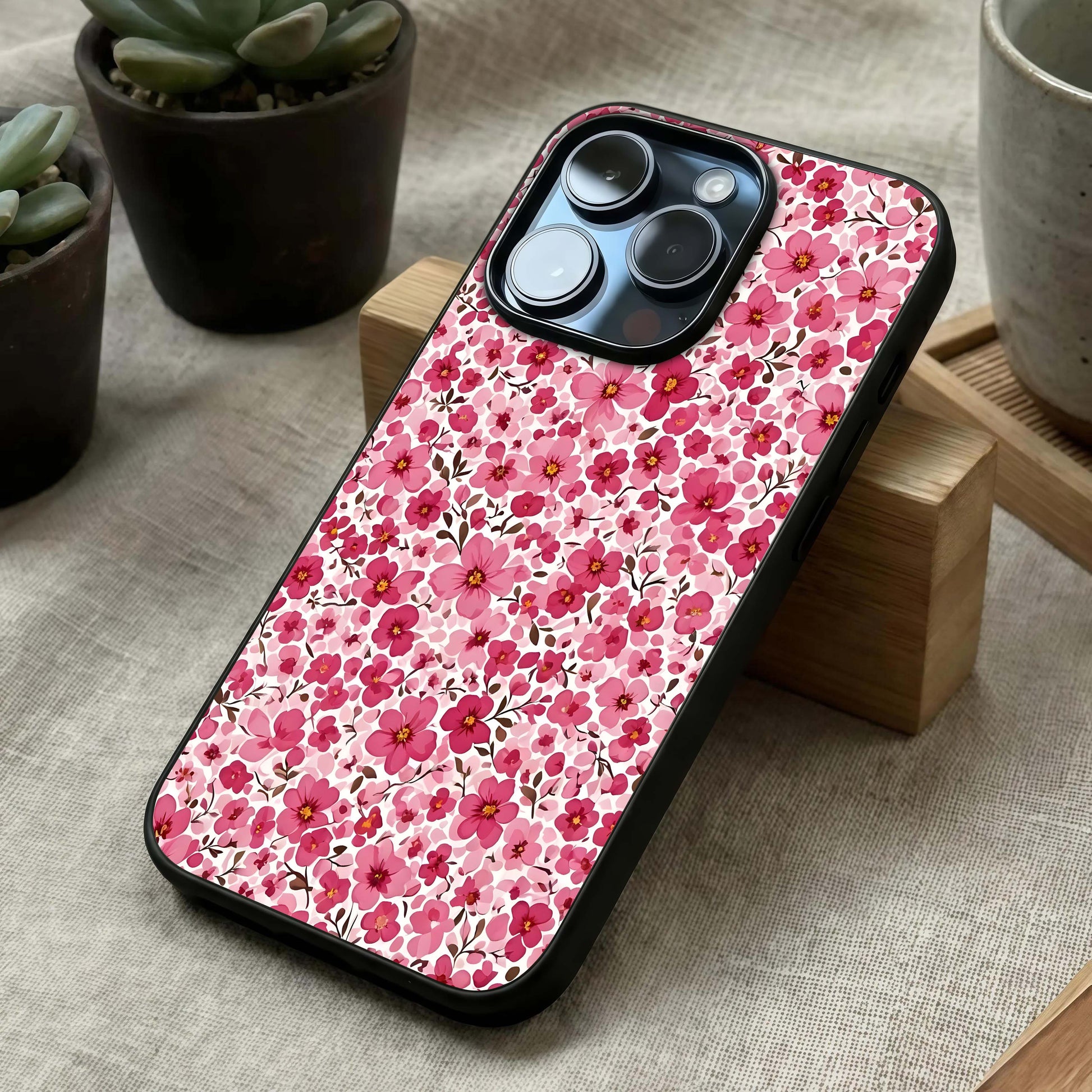 Cherry Blossom Charm Glass Case laid diagonally highlighting soft composition and HD glass shine.