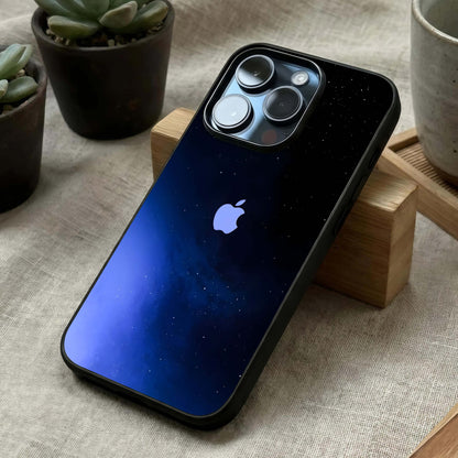 Cosmic Blue Apple Glass Case laid diagonally highlighting stellar accents and HD glass shine.