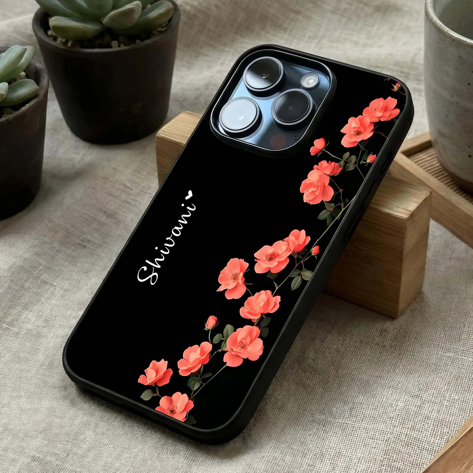 Crimson Bloom Grace Custom Name Glass Case laid diagonally highlighting graceful flow and HD glass shine.