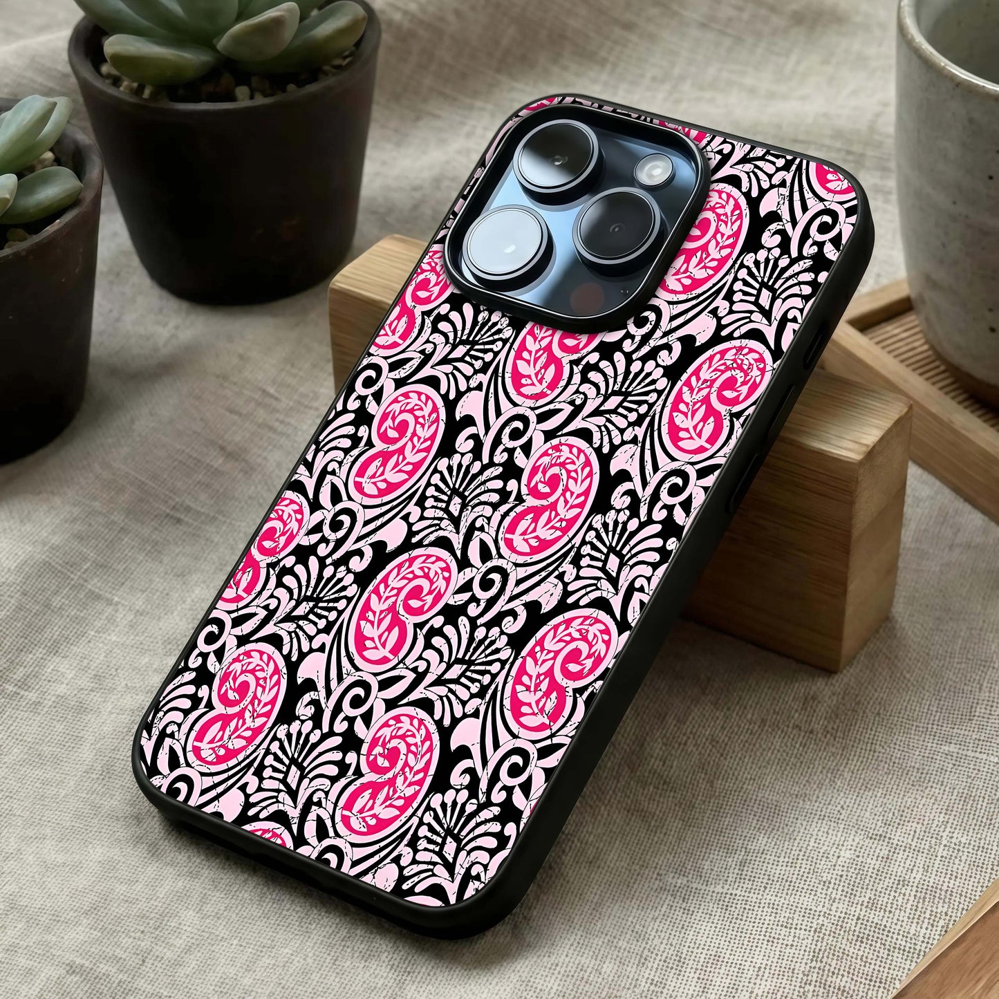 Crimson Paisley Charm Glass Case laid diagonally highlighting classic flow and HD glass shine.