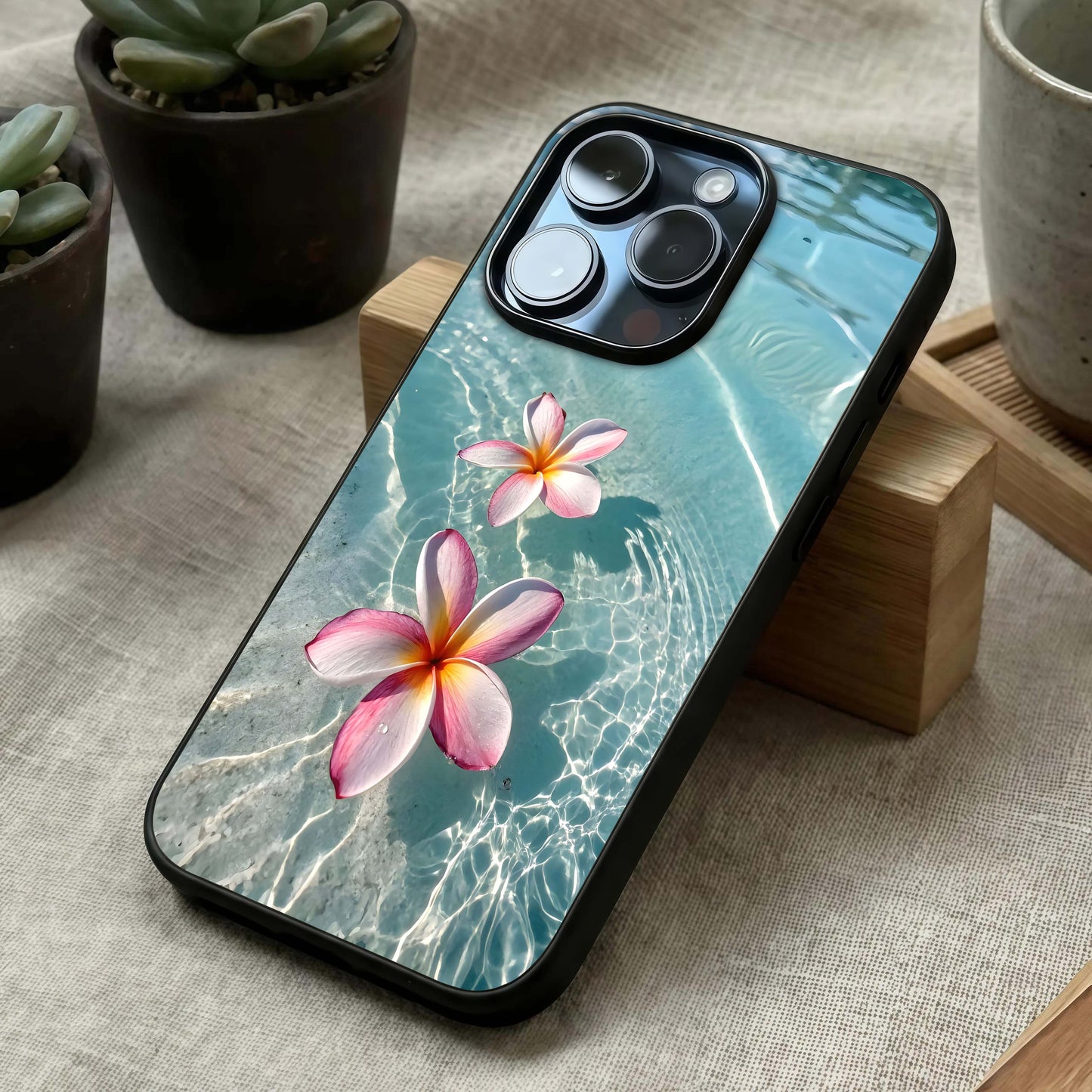 Floating Bloom Bliss Glass Case laid diagonally highlighting soft motion and HD glass shine.