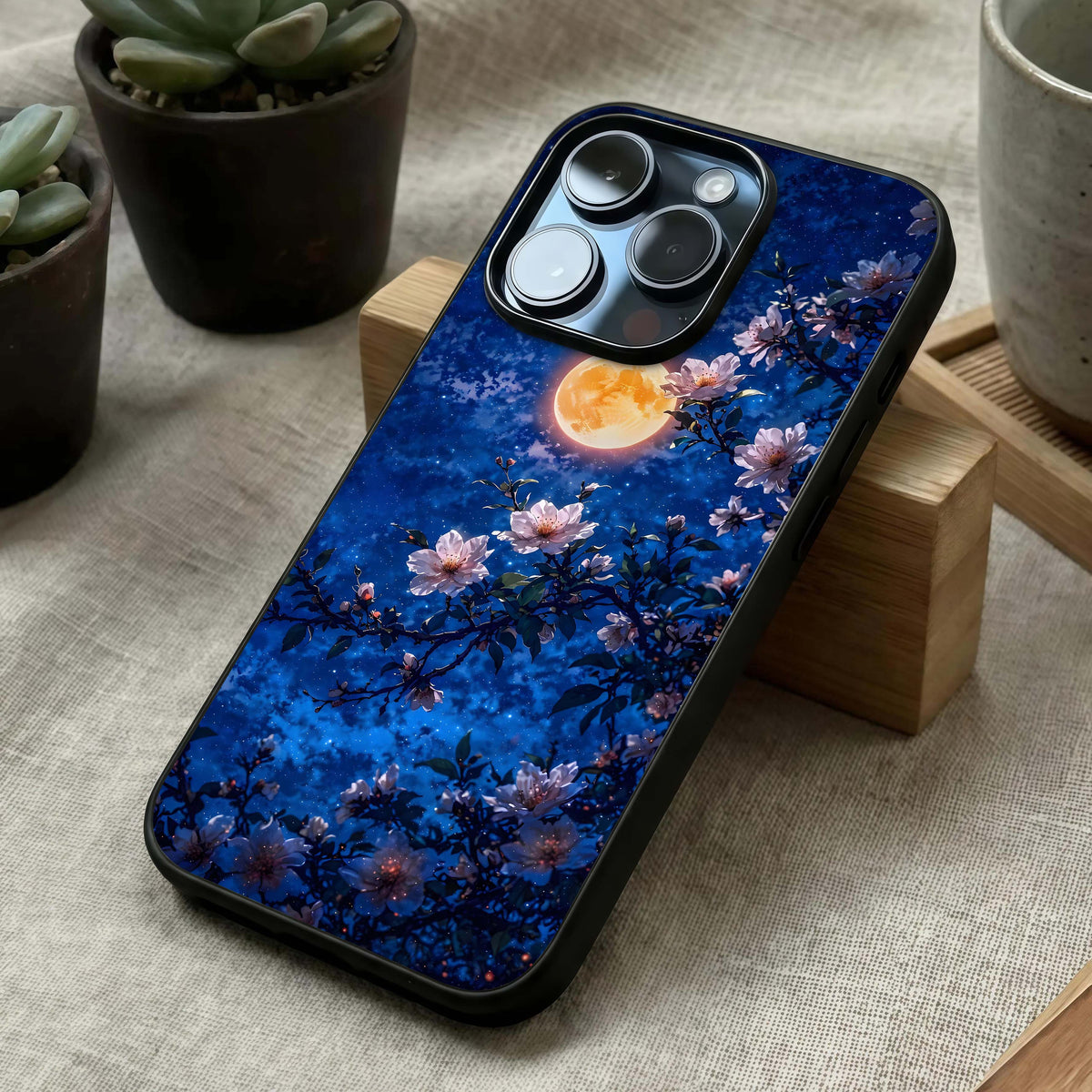 Moonlit Blossoms Night Glass Case laid diagonally highlighting gentle bloom flow and HD glass shine.