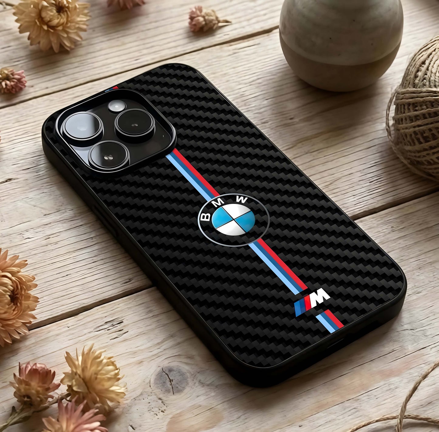 BMW Pattern Glass Case photographed in natural light showing reflective finish and layered depth.