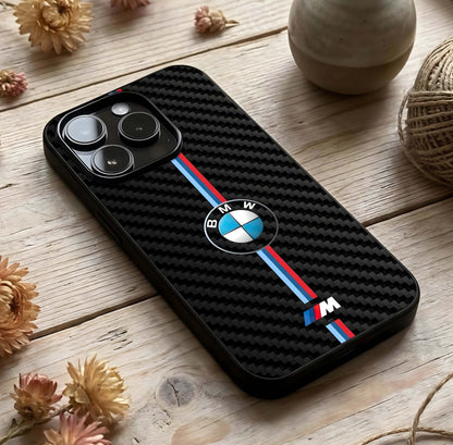 BMW Pattern Glass Case photographed in natural light showing reflective finish and layered depth.