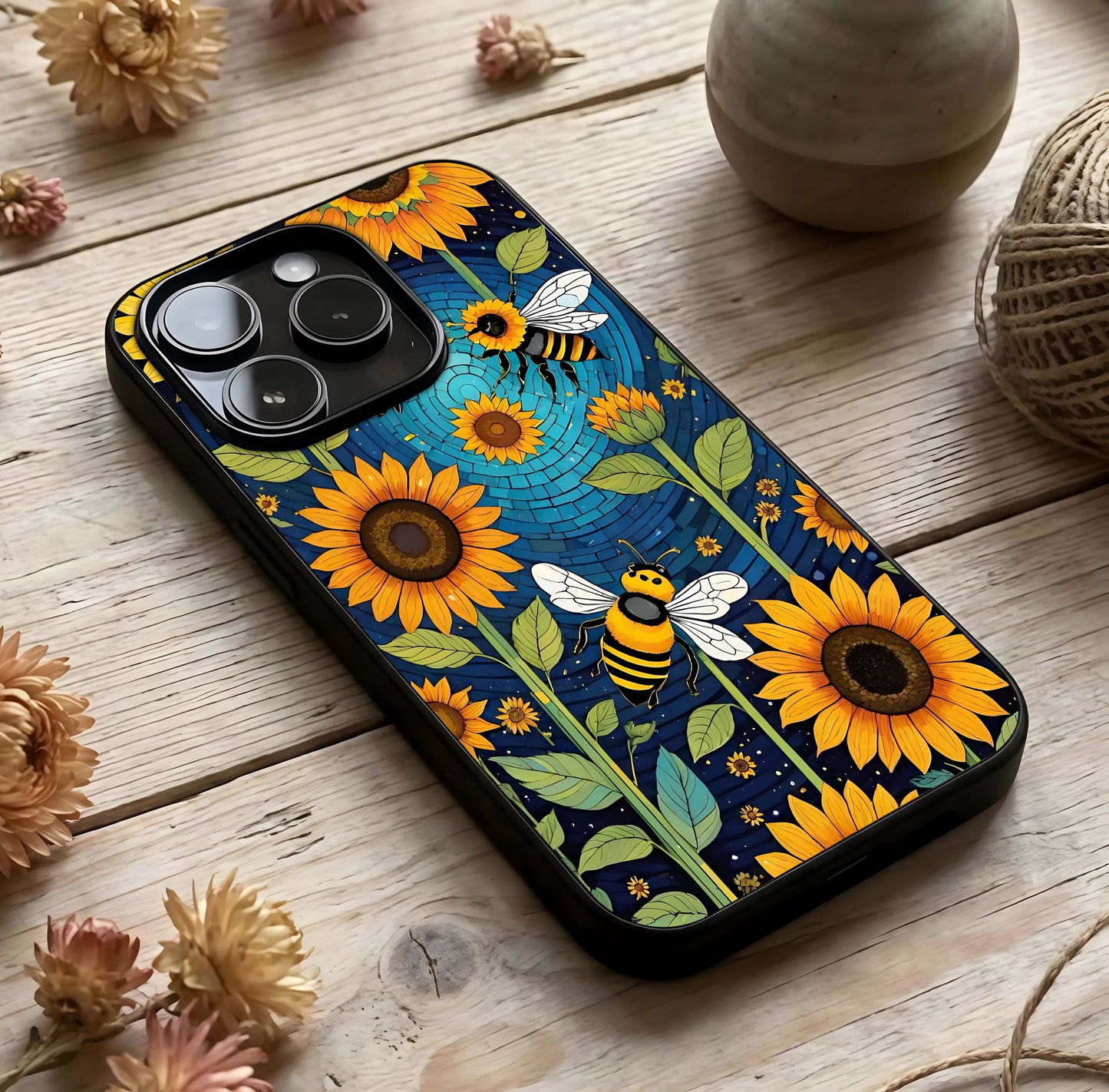 Bees & Sunflowers Glass Case photographed in natural light showing reflective finish and organic design depth.