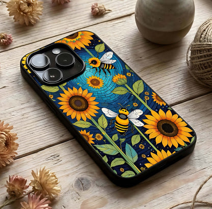 Bees & Sunflowers Glass Case photographed in natural light showing reflective finish and organic design depth.