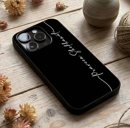 Black Tune Custom Name Glass Case photographed in natural light showing reflective finish and subtle design depth.