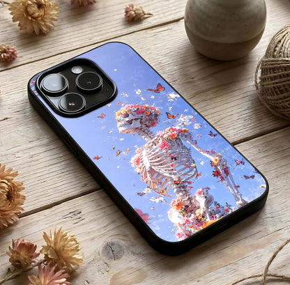 Bloom Beyond Bones Glass Case photographed in natural light showing reflective finish and artistic depth.