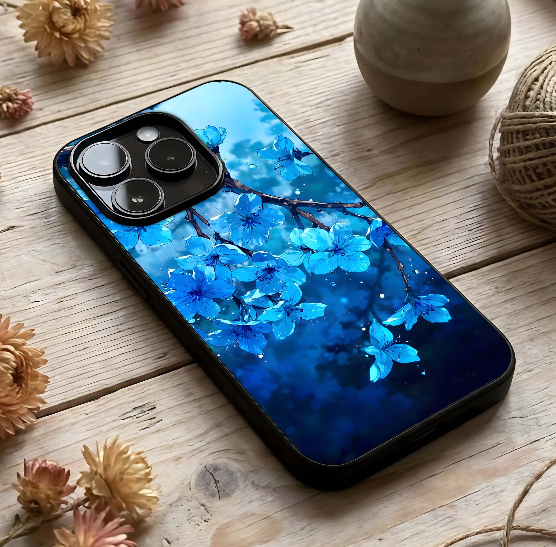 Blue Blossoms Branch Glass Case photographed in natural light showing reflective finish and organic depth.