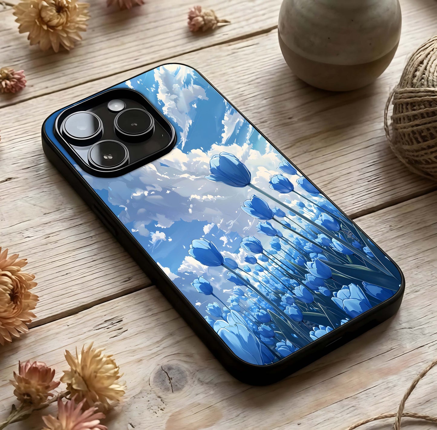 Blue Tulip Clouds Glass Case photographed in natural light showing reflective finish and light depth.