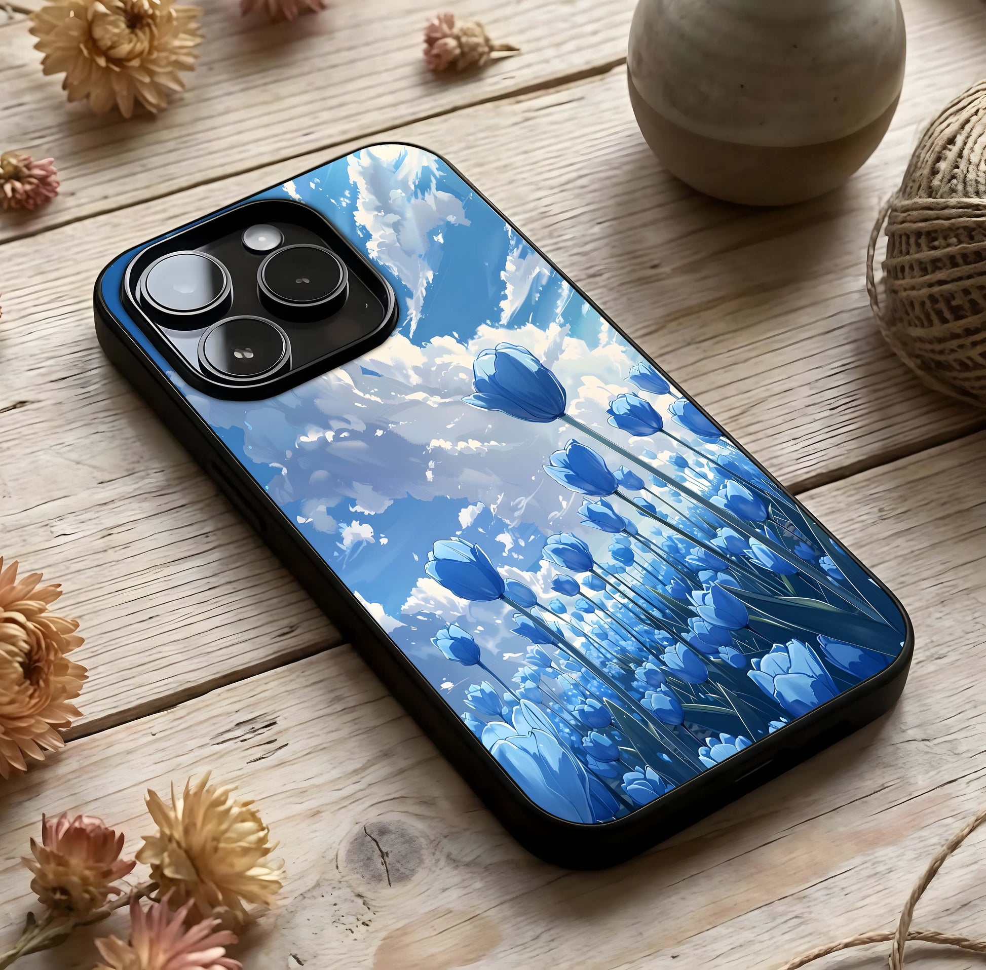 Blue Tulip Clouds Glass Case photographed in natural light showing reflective finish and light depth.