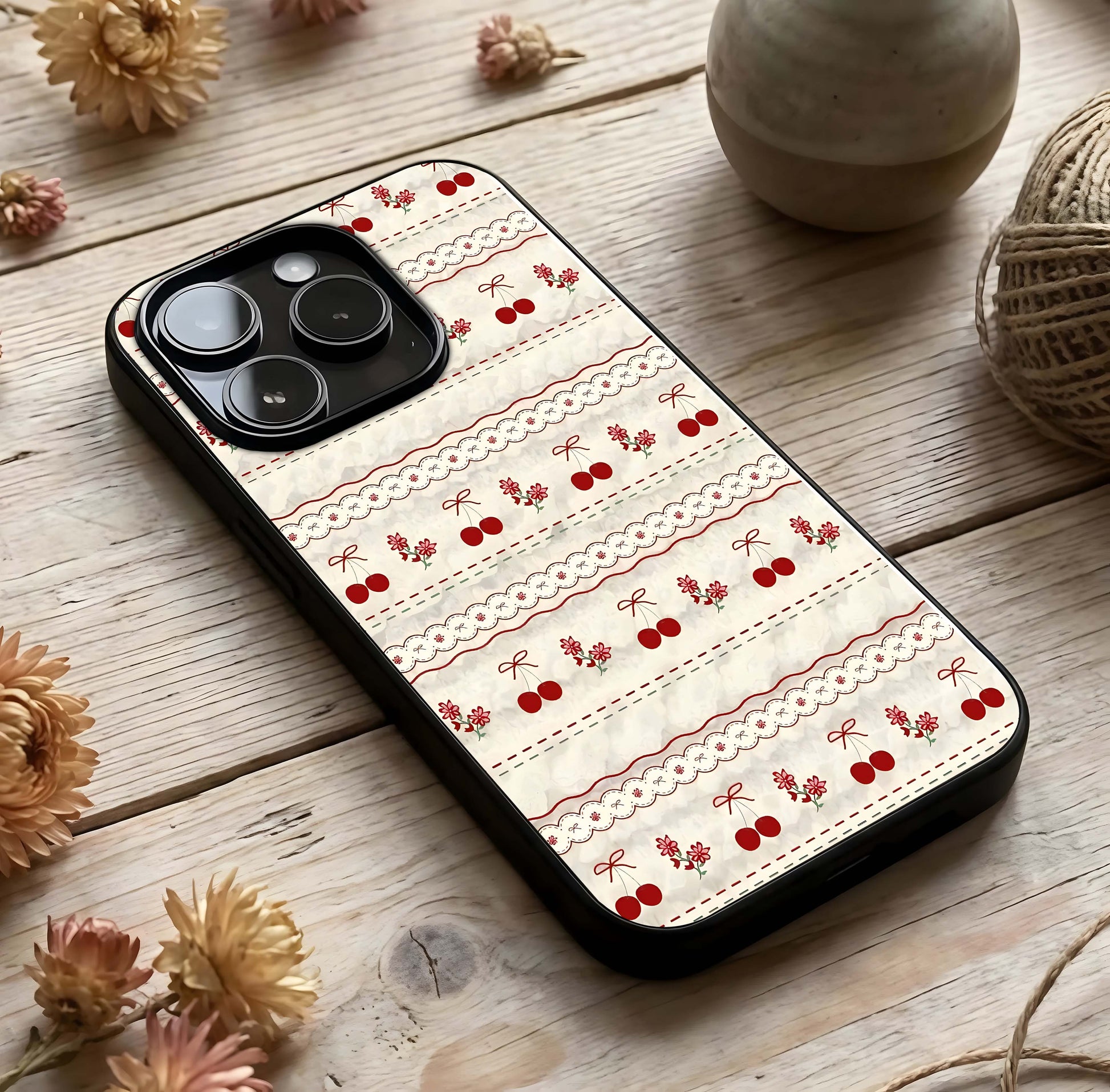 Cherry Bloom Charm Glass Case photographed in natural light showing reflective finish and gentle depth.