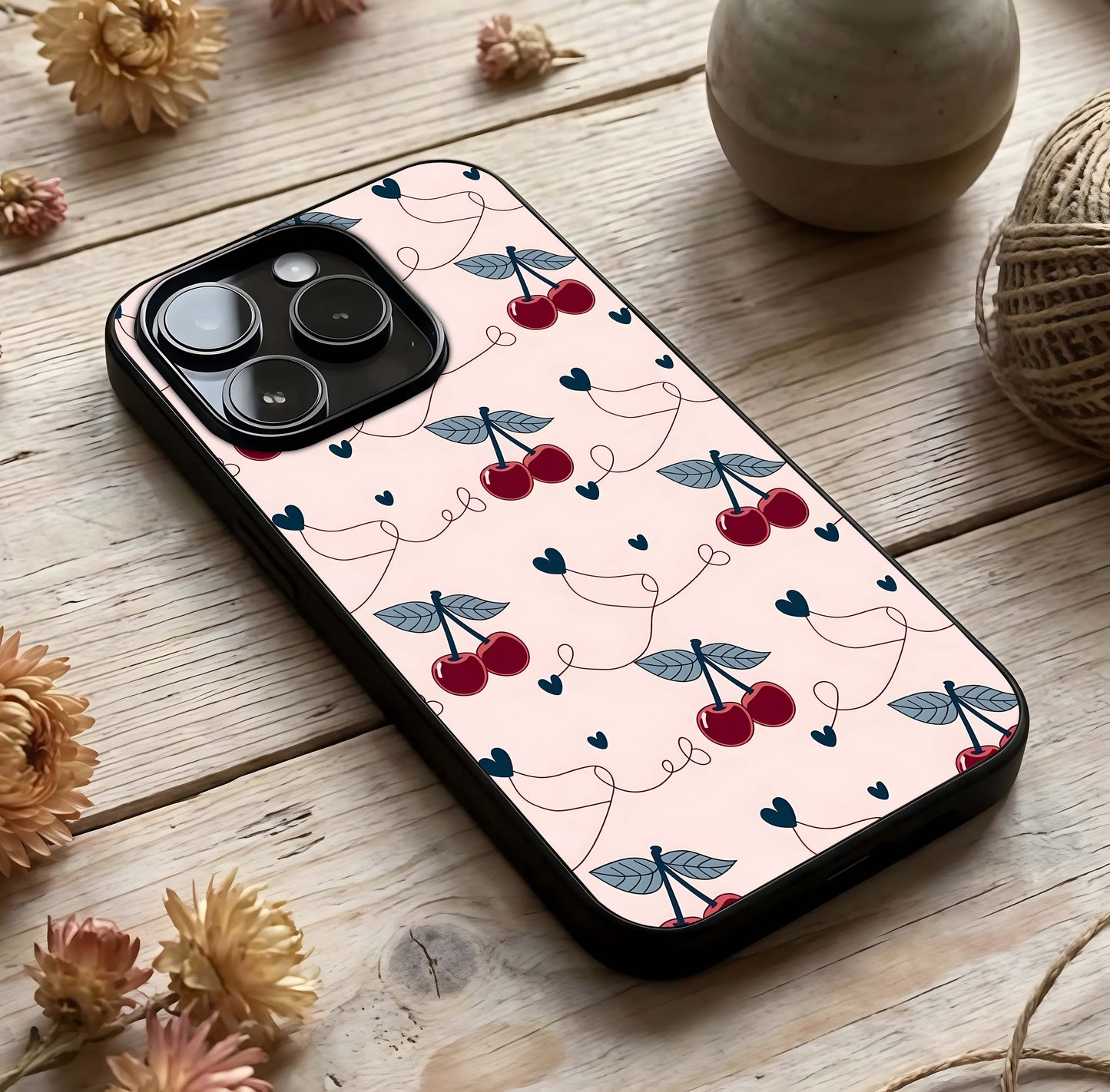 Cherry Heart Line Glass Case photographed in natural light showing reflective finish and soft depth.