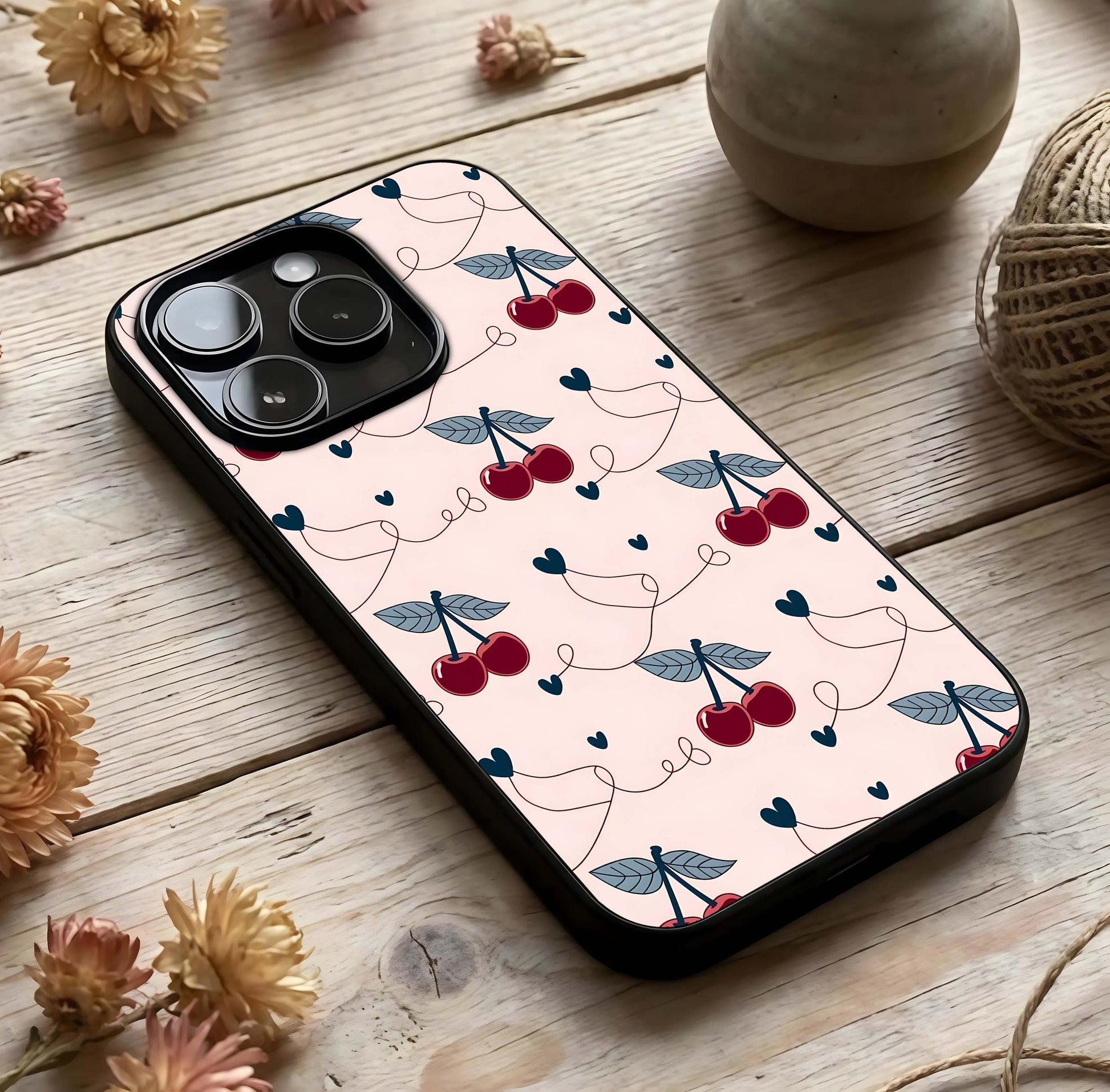 Cherry Heart Line Glass Case photographed in natural light showing reflective finish and soft depth.